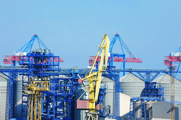 Fototapeta na wymiar Cargo crane and grain silo