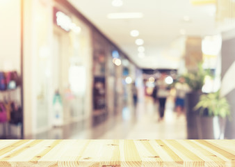 Blurred image of retail store in shopping mall for background.