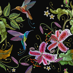Embroidery orchids and humming birds seamless pattern. Fashionable template for design of clothes. Beautiful orchids flowers and tropical birds classical embroidery seamless background