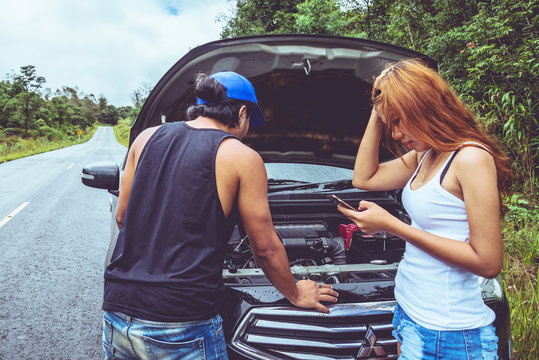 Asian Women And Men Lover Travel Relax In The Holiday. Broken Car On The Street. Thailand