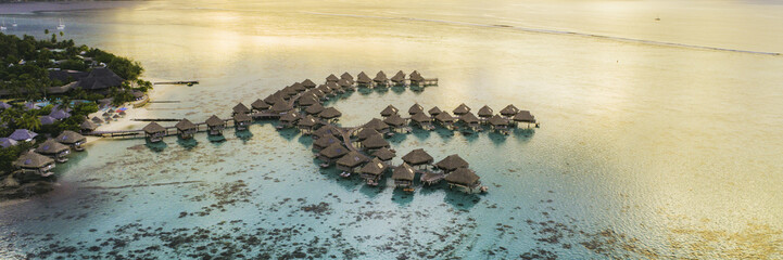 Luxury travel vacation destination panoramic banner. Romantic honeymoon getaway in overwater bungalows villas of Tahiti resort, Bora Bora, French Polynesia. Landscape copy space panorama.