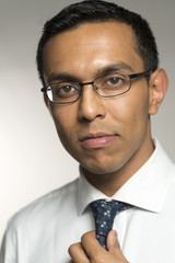 Closeup Portrait of Man in Glasses, Shirt, and Tie