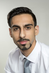 Closeup Portrait of Bearded Young Man in Business Attire