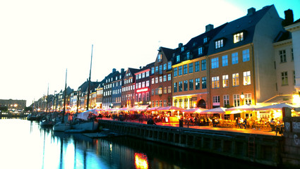 Nyhavn in Copenhagen during the evening twilight. Multicolored lights