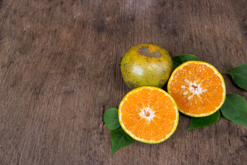 Orange  from above on wood table.