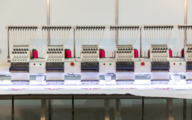 Professional sewing machine on fabric, nobody