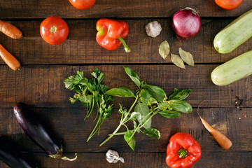 Various vegetables on dark wooden table, top view