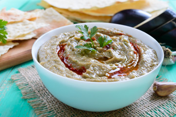 Baba ganush - hummus from eggplant with seasoning, parsley. Eastern cuisine.