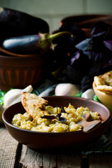 Eggplant pate in ceramic bowl. style rustic.