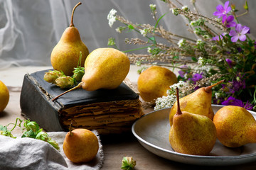 Autumn still life with pears and flowers