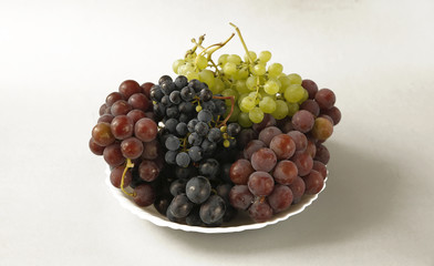 juicy grapes or a frame with grape on the white