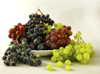 juicy grapes or a frame with grape on the white