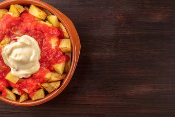 Patatas bravas, Spanish potato dish, overhead closeup shot