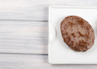 Burgers on white plate on wooden table. Food. Copy space.