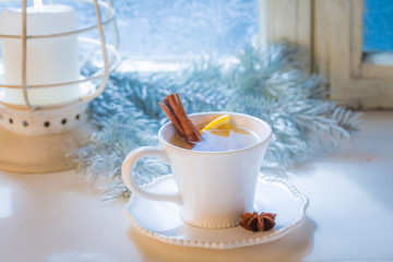 Hot and sweet tea with cinnamon and orange for Christmas