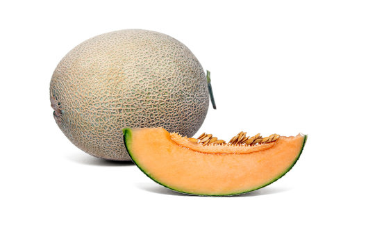 Melon fruit and sliced orange melon to show the juicy flesh and seeds on white background.