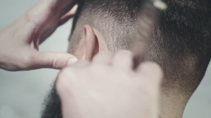 Barber haircut with straight razor. Close up of straight razor shave. Beard cut. Grooming beard. Barber shaving beard outside. Man hairdresser doing haircut beard. Cutthroat razor shave