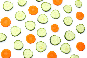 mix of sliced cucumber with sliced carrot isolated on a white background top view