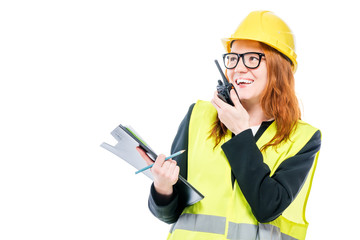 Girl professional foreman with walkie-talkie on white background