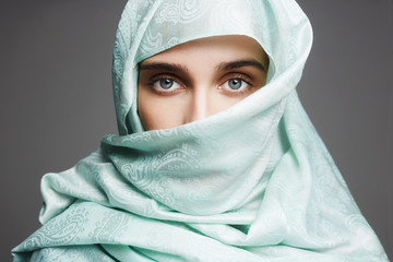 Fototapeta premium beautiful arabic woman in a blue cloth