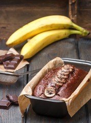 Cooking chocolate cake (bread) with a banana. Dessert for tea and coffee. Selective focus