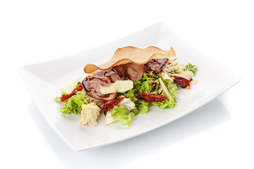 Restaurant food. Salad with bread in a plate. Delicious food.