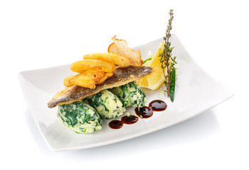 Fish with lemon and herbs. Isolated on white