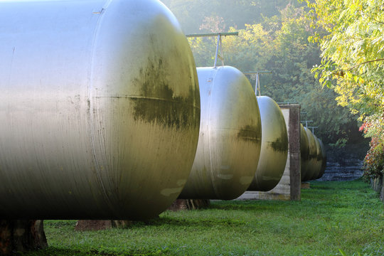 big tanks for the storage of methane gas in an industrial area
