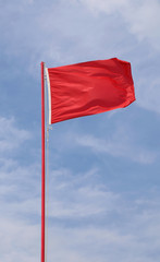 flying waving flag indicating a state of danger and alarm