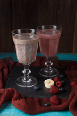 Picture of two glasses with smoothies on table