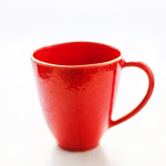 Red mug on a white background close up. Christmas red empty  cup for your design