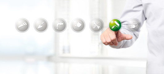 hand pushing on a touch screen interface paint roller symbol icon, web banner © amedeoemaja