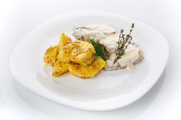 Delicious lunch. Potatoes in French mustard with meat in mushroom sauce