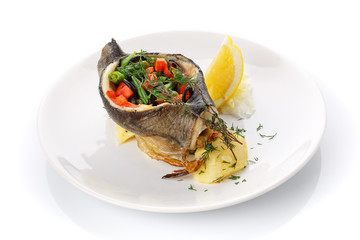 Delicious lunch. Stuffed fish with vegetables