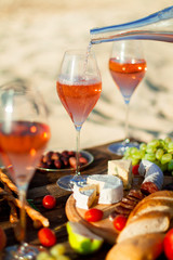 Refreshing  Rosa Wine in a Glass . Beach Cheers Celebration Friendship Summer Fun Dinner Concept.