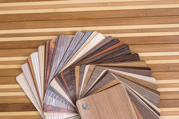 Samples of furniture or laminate  on desk of bamboo