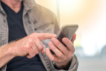 Man using smartphone, light effect