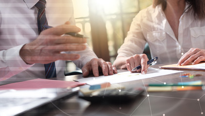 Senior manager working with executive assistant, double exposure, light effect