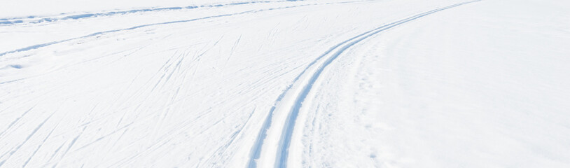 Winter landscape. Winter landscape. Ski track in the snow. Natural background, pattern.