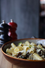 pasta mushroom truffle oil on wood background , Rigatoni pasta noodle with truffle oil mushroom and cheese , Italian food