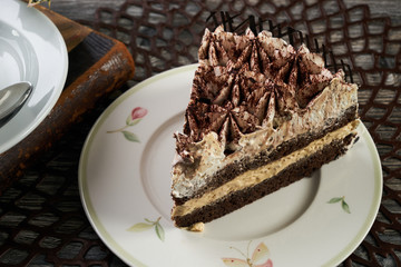 Cup of tea and Delicious chocolate cake with whipped cream