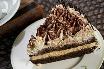 Cup of tea and Delicious chocolate cake with whipped cream
