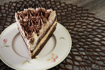 Cup of tea and Delicious chocolate cake with whipped cream