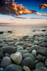 Obraz premium Beautiful pebbles on a sea shore