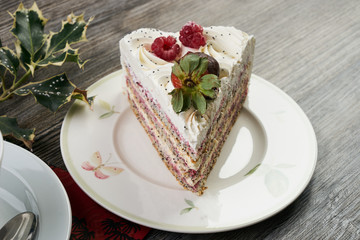 Sliced white Christmas cake with whipped cream