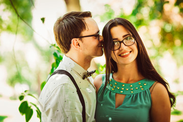 Beautiful young couple on the park background