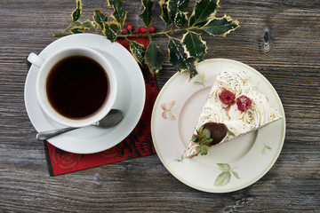 Sliced white Christmas cake with whipped cream