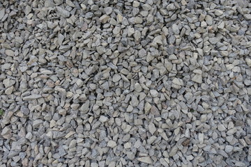 Heap of gray crushed stone from above