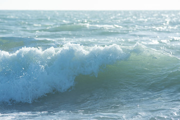 mediterranean sea waves breaking background, green water