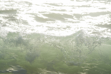 mediterranean sea waves breaking background, green water